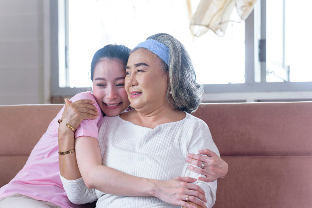 Mother and daughter hugging. Alternatives Inc.